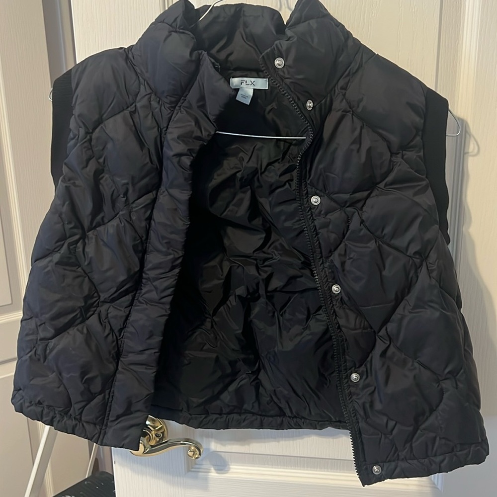 Black puffer vest size M, great condition